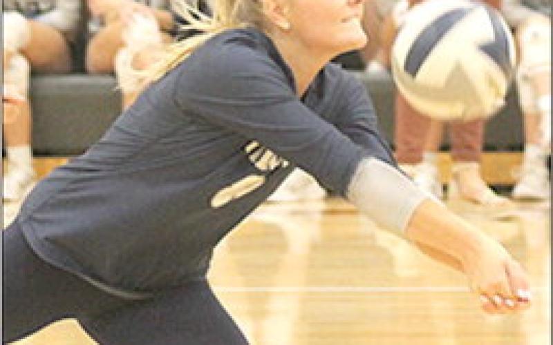 HTRS’ Jaylee McNealy goes after a dig against E-MF in the 3rd place Pioneer game. McNealy had 12 digs in the Lady Titans’ four set win over the Lady Bobcats. Paula Jasa/Republican