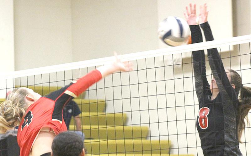 P.C.’s Hallye Friedly (#8, right) goes up for a block against a JCC hitter. Paula Jasa/Republican