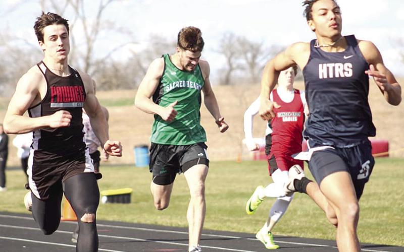 HTRS’ J.J. McQueen (right) finishes just ahead of P.C.’s Jett Farwell (left) in the boys’ 200 M. Dash at the JCC Invitational last Tuesday. Photo courtesy of Jamie Maloley