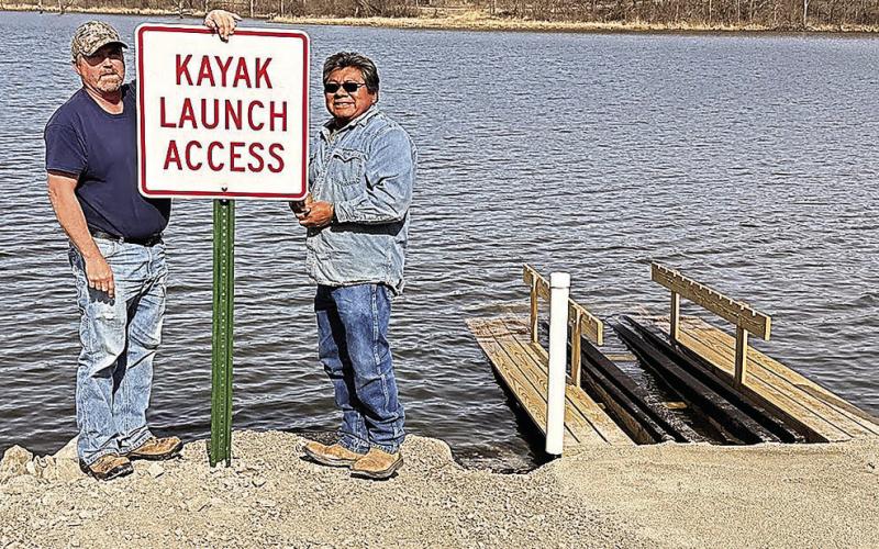 Last week, NRD workers Tomas Chale, Ken Hattun, and Aaron Stalder installed the launch at Iron Horse. On Friday, they returned and Tomas and Ken installed a sign. Photo by Sharla Sitzman