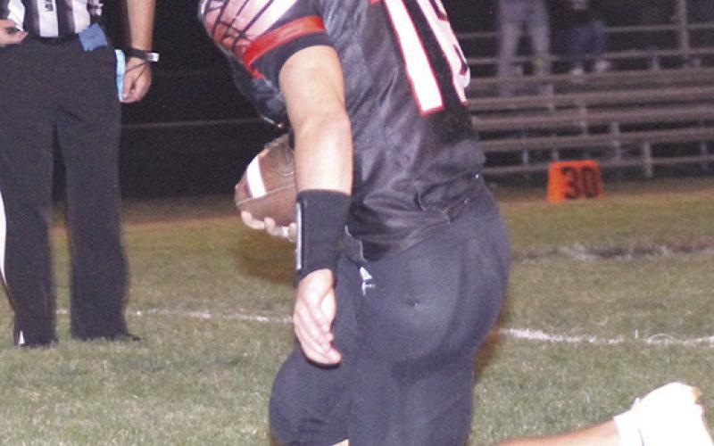 P.C.’s Anthony Kling (#16) returns an interception 37 yards for a touchdown against Lewiston on Friday night as the official watches on the change of possession. Paula Jasa/Republican