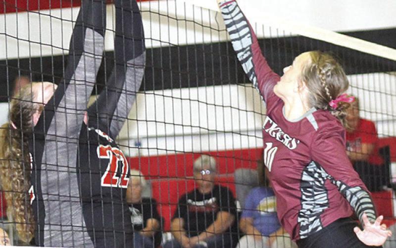 Pawnee City’s Adelyn Sisco (#22, left) and Lewiston’s Jenna Anderson (#10, right) go head to head at the net. Paula Jasa/Republican