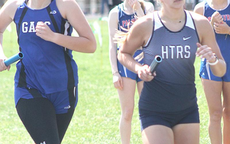 HTRS’ Laramie Glathar (right) keeps her pace in the 3200 M. Relay event. Paula Jasa/Republican