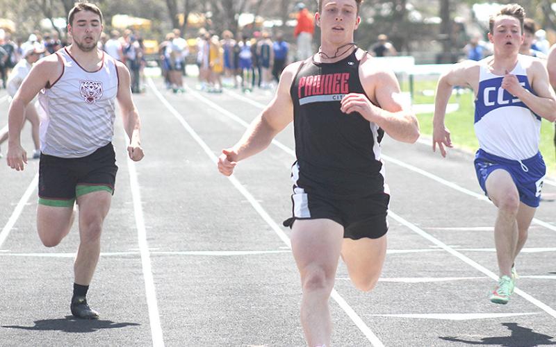 Pawnee City’s Andy Maloley (center) crosses the finish line first ahead of Lewiston’s Brady Bledsaw (left) in the prelims of the 100 M. Dash. Maloley placed 3rd at 11.46. Paula Jasa/Republican