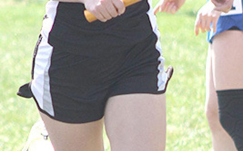 P.C.’s Madison Lytle runs the first leg of the girls’ 3200 M. Relay event. P.C. placed 4th at 9:53.56. Paula Jasa/Republican