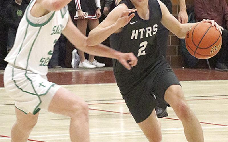 HTRS’ Brennen Vaughan (#2, right) drives the paint against FCSH in the Class B Championship game. Paula Jasa/Republican