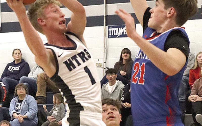HTRS Brogan Dunlap (#1) drives the lane against Palmyra as teammate Hunter Bohling (#22) looks on. Paula Jasa/Republican