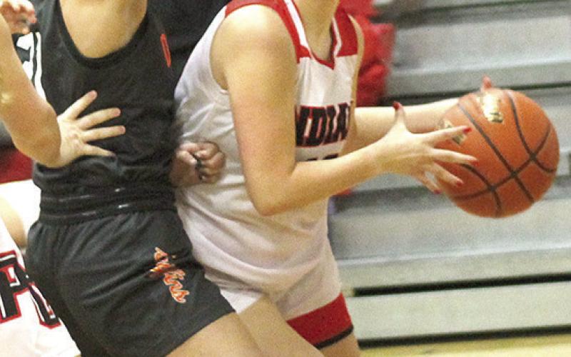 P.C.’s Neveah Blecha (right) drives the baseline against Diller/Odell in Thursday night’s season opener. Paula Jasa/Republican