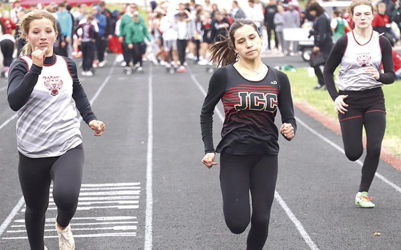 Lewiston’s Justice Currie (left) and Sara Wiles (right) come down the stretch of the girls’ 100 M. Dash prelims on Saturday. Paula Jasa/Republican