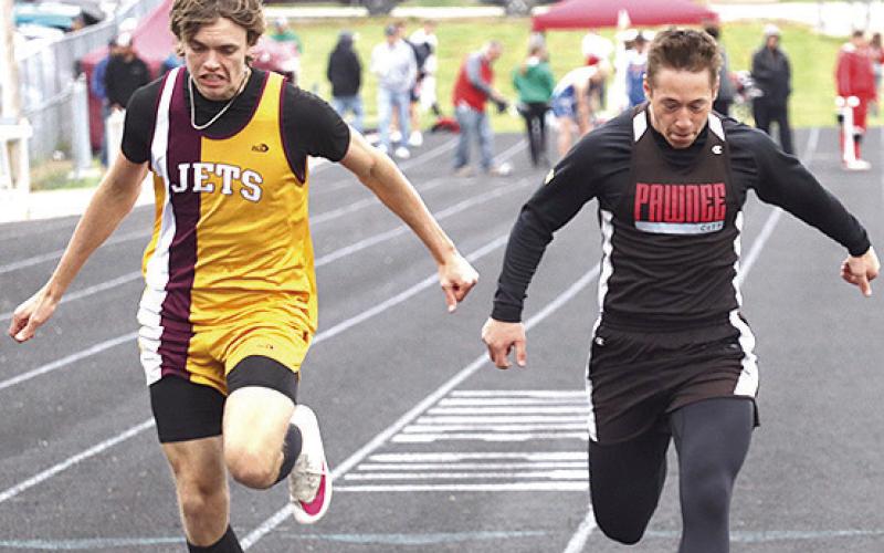 P.C.’s Jesse McLaughlin (right) crosses the line just ahead of Sterling in the boys’ 100 M. Dash prelims. Paula Jasa/Republican