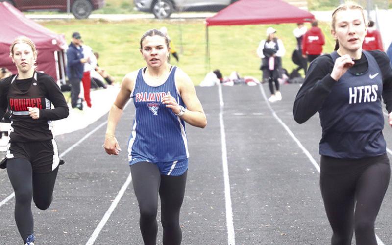 HTRS’ Lily Wamsley (pictured far left) and teammate Makena Dunlap (pictured above right) finish their heat of the girls’ 400 M. Dash along with Pawnee City’s Cara Pierce (pictured above, left). Paula Jasa/Republican