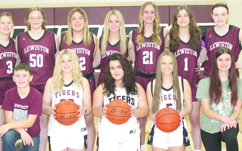Members of the 2024-25 Lewiston Girls’ Basketball Team are from left: Corbin Crouse, s.m., Owen Wehrbein, s.m., DeLanye Currie, Natasha Ellis, Jenna Anderson, Brooklyn Eggert, s.m., Izzy Meyers, s.m. Back row: Ayden Hunzeker, Vivienne Johnsen, Bryleigh Crouse, Justice Currie, Maddie Janssen, Savannah Cutshall, Sara Wiles. Not pictured: Coaches Allison Nissen and Tracie Wehrbein.