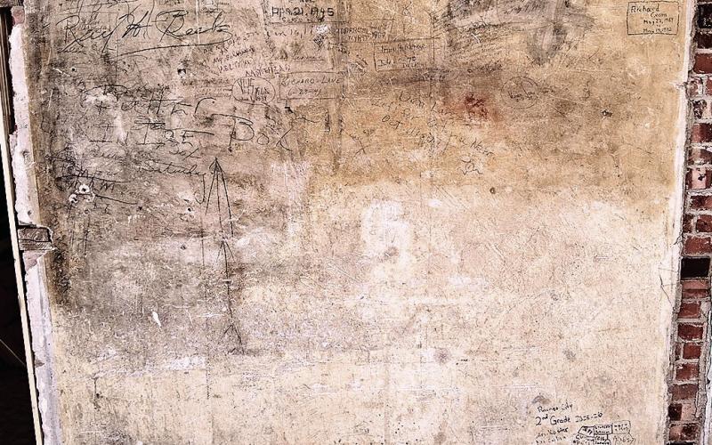 A full view of the back wall of Old Guys Brew where signatures dating back to the late ‘30s can be found