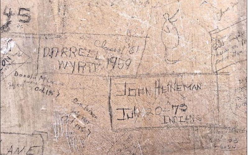 Darrell Wyatt was looking ahead to being a member of the class of ‘61 back when he signed the wall in ‘59 while John Heineman was showing school pride in ‘73