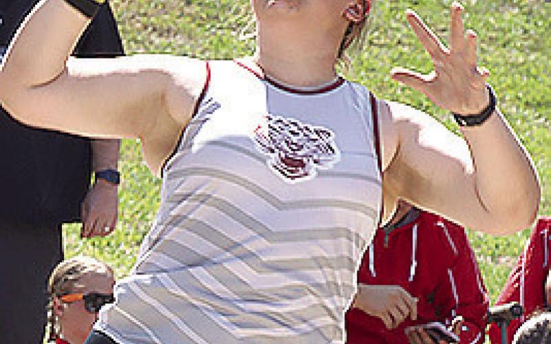 Lewiston’s Axel Seeman (left) finishes in the 800 M. Run while Pawnee City’s Dylan Layne (right) heaves a big throw in the boys’ Shot Put event. Pawnee City’s Atreyu Kling (above) clears the bar in the boys’ Pole Vault while LHS’ Bryleigh Crouse (above right) gets off a good throw in the girls’ Shot Put.