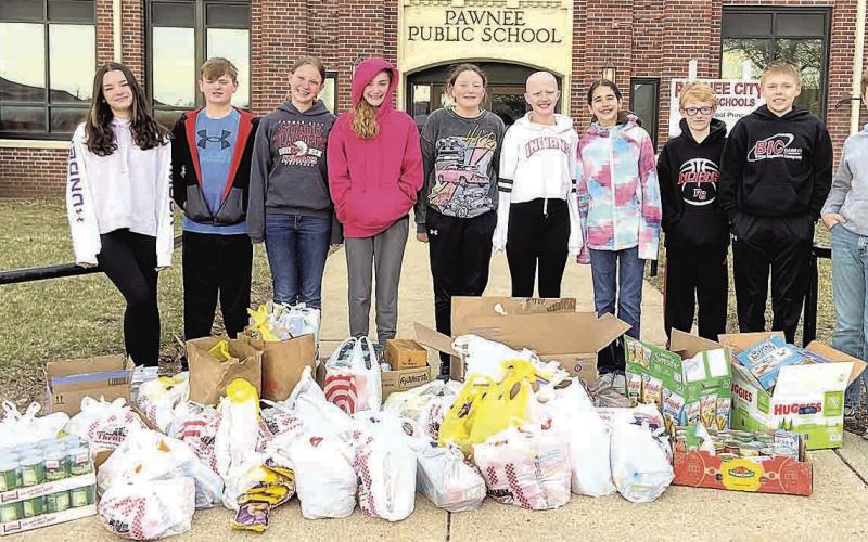 The Pawnee City Middle School Leadership Team collected over 600 items for donation to the SENCA food pantry. Pictured L to R: Ava Schlund, Isaac Rottinghaus, Ainsley Rauner, Aubrey Sisco, Amelia Strathman, Emma Turnbull, Sophia Sunneberg, Zeke Ferebee, Ryan Plager and Lane Johnson.