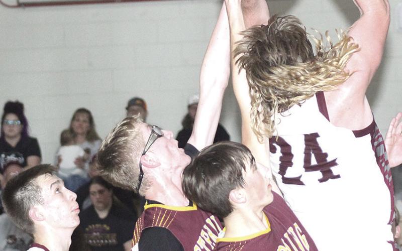 LHS’ Tristen Ray (#24, right) goes up strong under the basket against Sterling in Friday night’s game. Paula Jasa/Republican