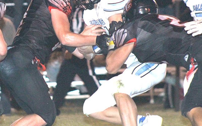 P.C.’s Jesse McLaughlin (left) and Atreyu Kling (#2, right) combine for a stop in Friday night’s game. Paula Jasa/Republican