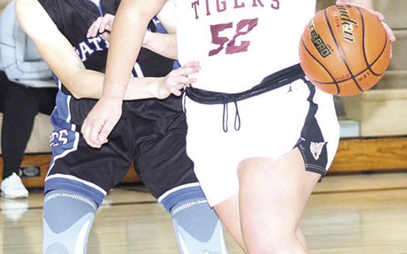 LHS’ Bryleigh Crouse (#52, right) drives past a Parkview Christian defender in Thursday night’s game. Paula Jasa/Republican
