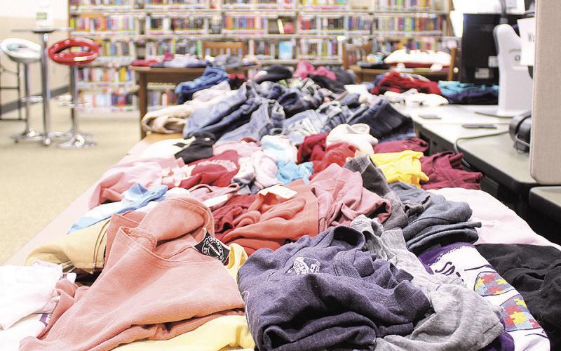 Library Hosts Free Clothing Giveaway and Henna Artist