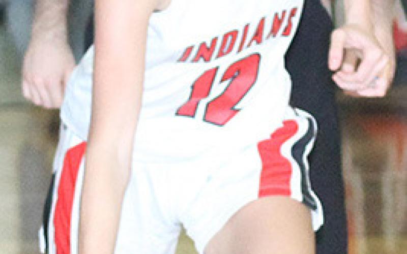 Pawnee City’s Kinsley Benson (#12) brings the ball down the floor.