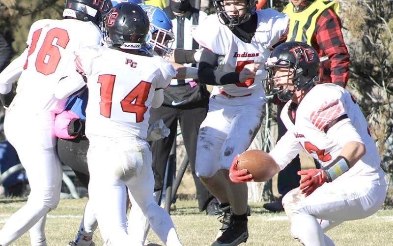 photo courtesy of Jamie Maloley P.C.’s Andy Maloley (#12, right) makes a move behind his blockers including Anthony Kling (#16, left, Jett Farwell #14 and Justin Pierce (#5). Maloley led the Indians with 22 carries for 167 yards and 4 TD’s.
