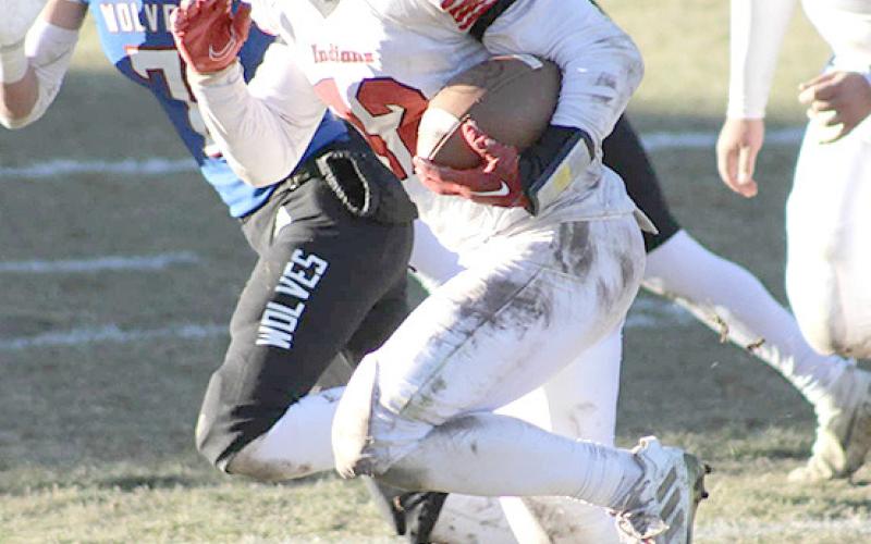 P.C.’s Andy Maloley (#12, right) takes off over the left side of the defense against Arthur County. photo courtesy of Jamie Maloley