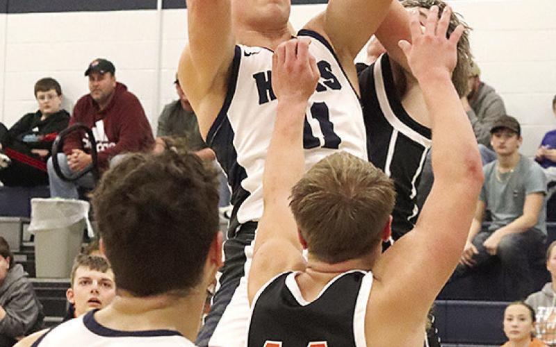 HTRS’ Emmett Glathar draws a foul against Falls City on Thursday night. Glathar topped out in scoring for HTRS with 26 points against the Tigers. Paula Jasa/Republican