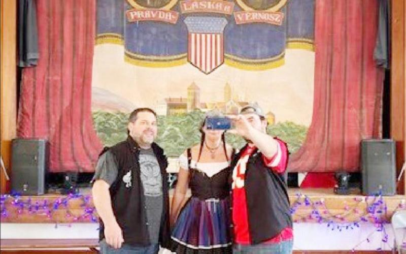 Before a recent performance, Angie Kriz with band members Craig &amp;amp; Jason Falls take a selfie with the stunning curtain
