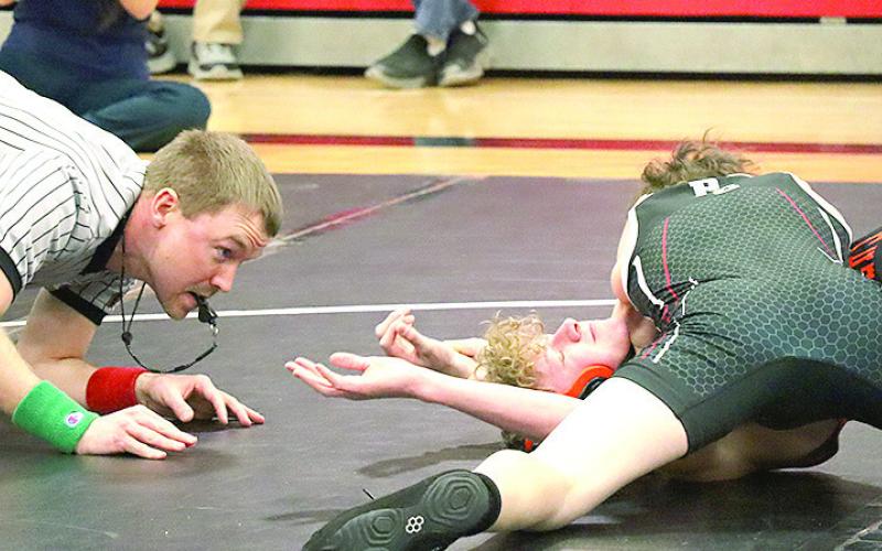 P.C.’s Luke Hunzeker (on top, right) gets the pin against a Falls City opponent. Paula Jasa/Republican