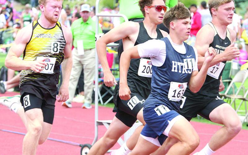 HTRS’ Kameon Dettmann (#163, center) stays in stride with his fellow competitors in the Class D boys’ 800 M. Run on Saturday. He set a personal best time of 2:05.51. Photo courtesy of Stephanie Croston/Seward County Independent
