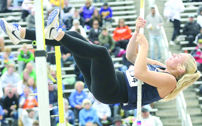 HTRS’ Elie Bstandig goes up and over the bar in the Class D girls’ Pole Vault on Friday. She cleared 8’0” in the event. Photo courtesy of Luke Nichols/Beatrice Daily Sun