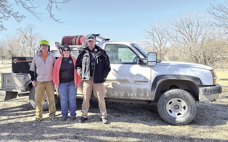 The stolen grass rig has been recovered and towed back to Pawnee County. Pictured L to R: Gary Leatherman, Crime Analyst Nancy Tilton, Sheriff Braden Lang photo by Courtney Kosiski