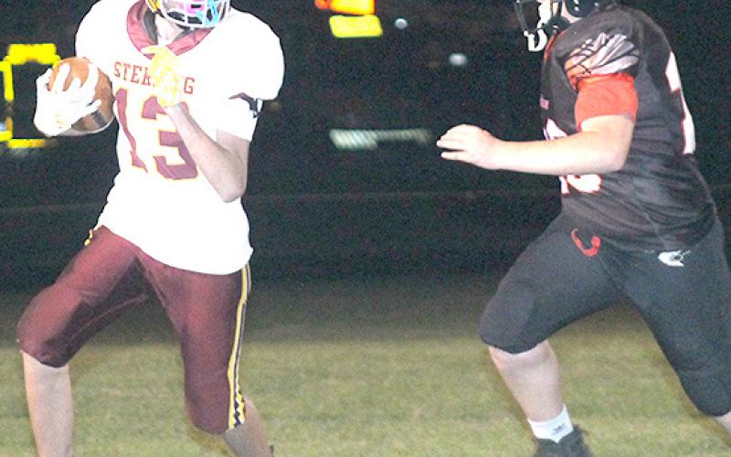 P.C.’s Hayden Binder (#33, right) pursues a Sterling ball-carrier late in the game. Paula Jasa/Republican