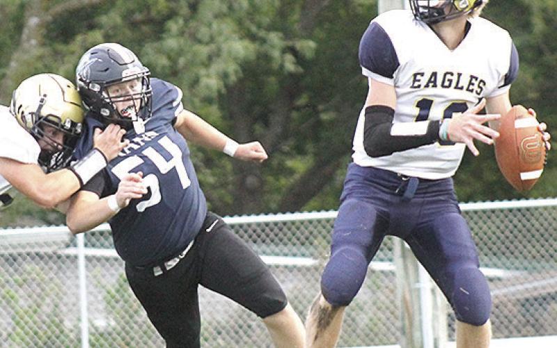 HTRS’ Jonathan Koch (#54) works his way into the backfield to go after OCA’s quarterback. Koch hurried the quarterback several times and had 5 tackles. Paula Jasa/Republican