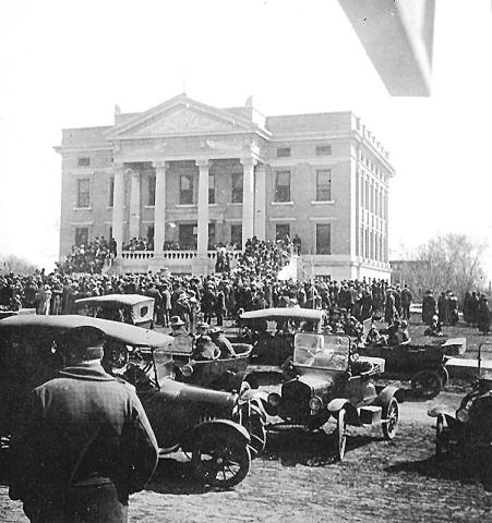 The Pawnee County Courthouse on November 11, 1918 as citizens gathered to celebrate Armistice Day, the conclusion of World War I. Construction of the courthouse had begun in 1911 and completed by 1912. The building was still very new. Photo by Archer King, courtesy of Table Rock Historical Society.
