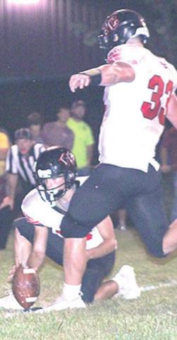 PC’s Simon Osborne kicks the PAT in the 1st quarter to make it 8-14. Paula Jasa/Republican
