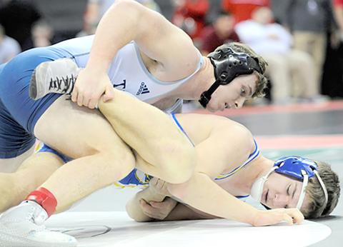 HTRS/P.C.’s Andy Maloley (left, on top) takes down Tri-County’s Cael Washburn at the State Wrestling Tournament on Friday. Maloley won by an 8-0 Major Decision. photo provided by Luke Nichols/Beatrice Daily Sun