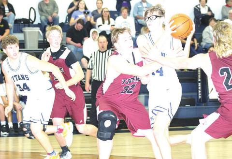 Paula Jasa/Republican HTRS’ Gage Schaardt (#14, center) draws a crowd of Lewiston players including Tristen Ray (#24, right) and Ty Arena (#32, center) as teammates Andrew Stalder (#34) and Caleb Rule (left) look on. Pictured right is LHS’ Brady Bledsaw against Stalder.
