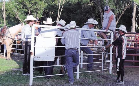 Dan Whitney, better known as 'Larry the Cable Guy' chats with performers before night one of the rodeo.