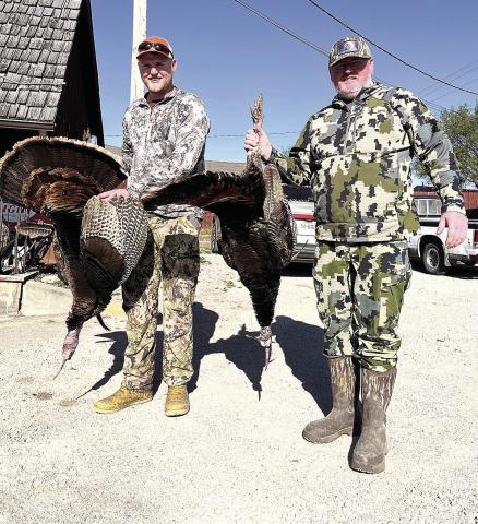 Adult division third place finisher Casey Henry (right) with son Bo Henry (left)