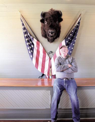 Jim Tegtmeier in his store with his prized buffalo head