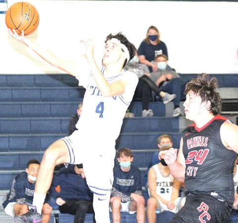 HTRS’ Nic Knudson (#4) scores on one of his many steals and layups in the game against Pawnee City. Knudson poured in 34 points to lead the Titans to victory. Paula Jasa/Republican
