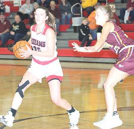 P.C.’s Hallye Friedly (#15, left) works the ball around the top of the key against the Sterling Lady Jets. Paula Jasa/Republican