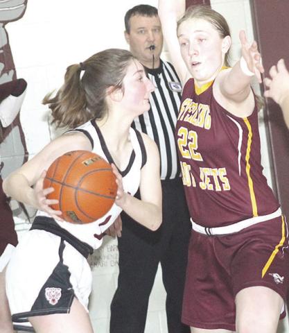 LHS’ Kierstin Rehrs (left) looks to pass to a teammate in Friday night’s game.