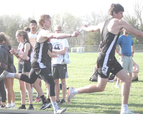 P.C’s Kyle Gyhra hands off to teammate Bryce Gyhra in the boys’ 1600 M. Relay. photo courtesty of Ann Wickett