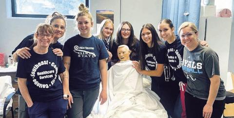 Pictured are students: Jenny Ouding, Leann Johnson, Delayne Currie, Anna Meints, Riley Hock, Naomi Rodriquez, Logan Maloley, and Instructor Kelsey Johnson, RN.