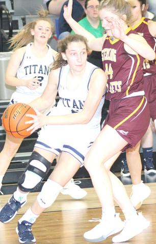 HTRS’ Ellie Schaardt (#5, left) drives past a Sterling defender as teammate Saydee Hardesty (#12, left) looks on. HTRS came up short, 30-47 against Sterling. photo by Paula Jasa/Republican