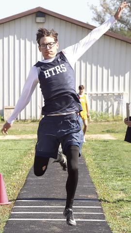 HTRS’ Kiffen Hunzeker flies through the air in the boys’ Triple Jump event where he took the silver medal. Paula Jasa/Republican