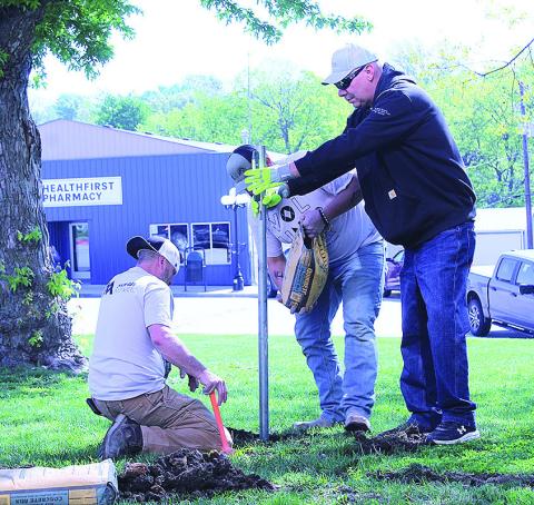 Volunteers Install New Flag Poles On Courthouse Lawn
